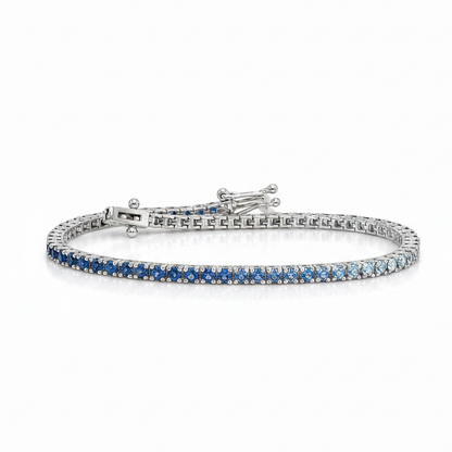 14k white gold tennis bracelet with gradient of natural blue sapphires