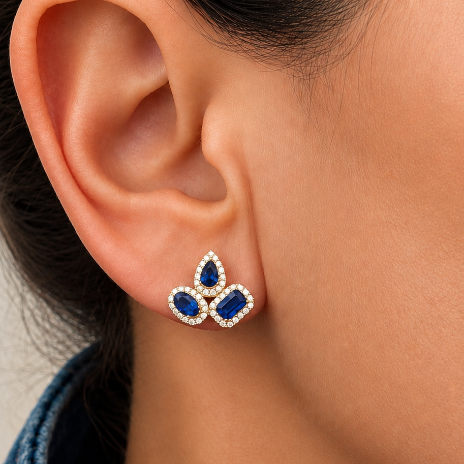 close up of mixed cut sapphire and diamond earrings detail