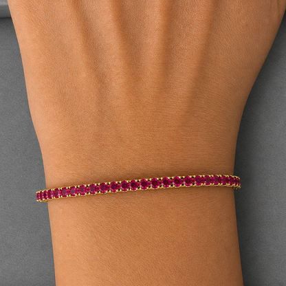 natural ruby tennis bracelet in 14k yellow gold close up detail