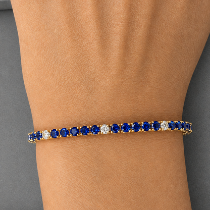 natural sapphire and diamond tennis bracelet in 14k yellow gold close up detail