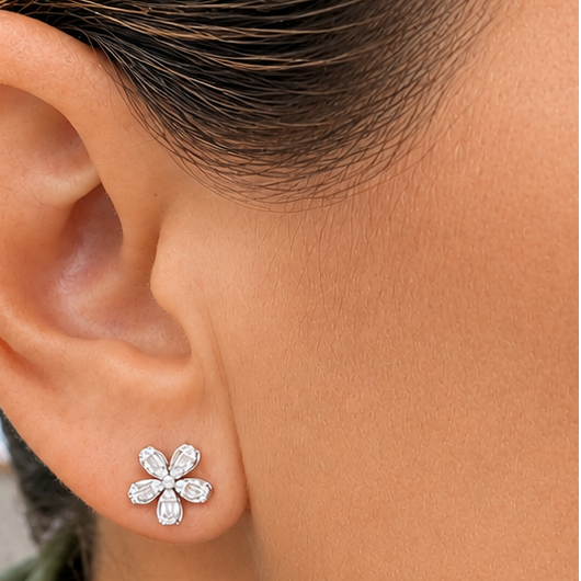 model wearing 18k yellow gold five petal flower diamond stud earrings