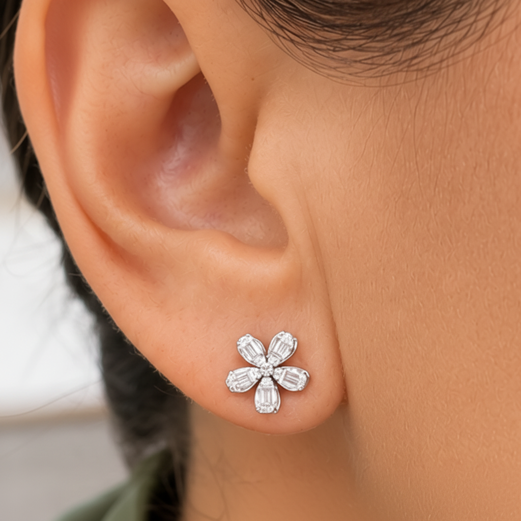 model wearing 18k yellow gold five petal flower diamond stud earrings