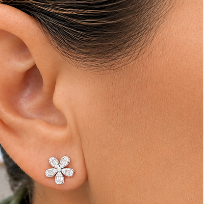 model wearing 18k yellow gold five petal flower diamond stud earrings