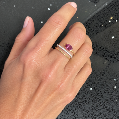 Detail of the open spiral setting and diamond-set coil on a red tourmaline cocktail ring