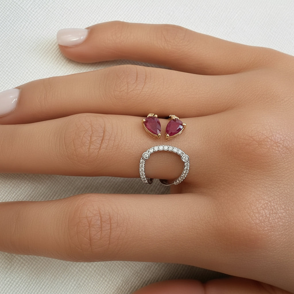 18k mixed yellow and white gold ring with two pear rubies and diamond accents