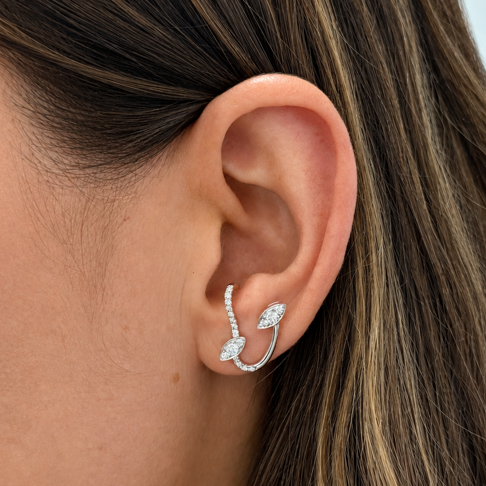 Detail of marquise-cut diamonds set along an 18k white gold ear climber