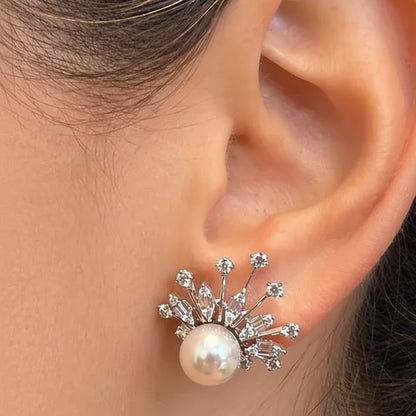 18k white gold stud earrings with 8 mm pearls and 0.84 cts of surrounding diamonds