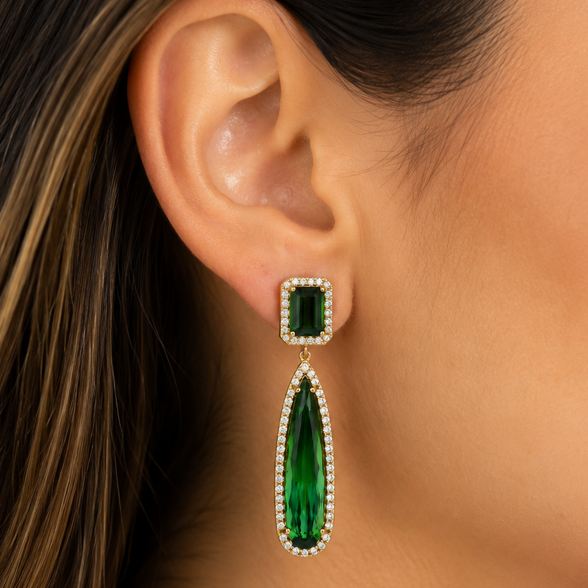 model wearing 18k yellow gold green tourmaline diamond drop earrings