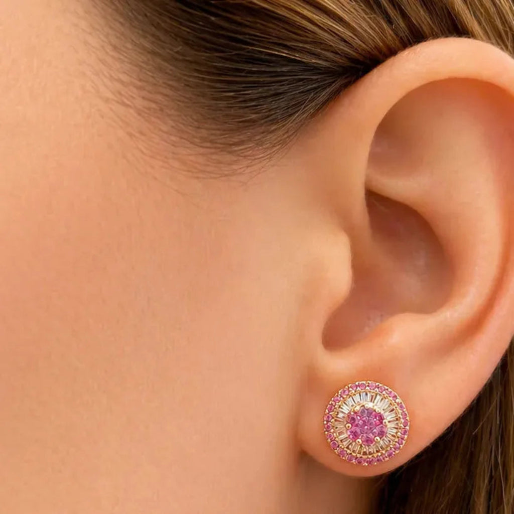 18k yellow gold cluster stud earrings with central pink sapphires and a diamond baguette-and-round border