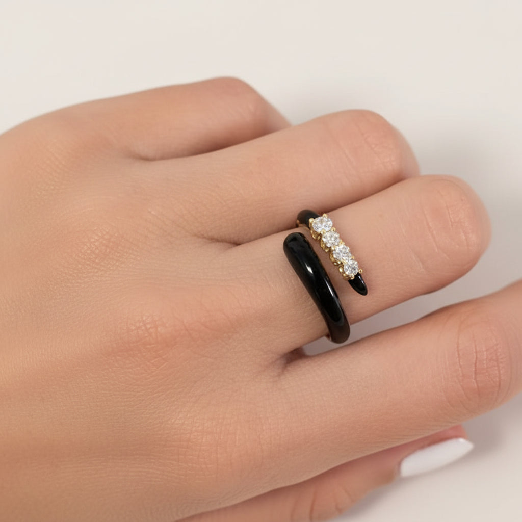 18k yellow gold open ring with black agate ends and four brilliant-cut diamonds totaling 0.32 carats