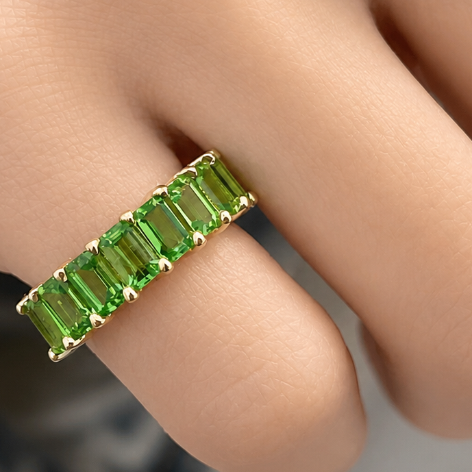 18k gold half band ring with 2.7 ctw emerald-cut tsavorite garnets by Diamond Tales