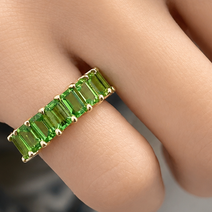 18k gold half band ring with 2.7 ctw emerald-cut tsavorite garnets by Diamond Tales