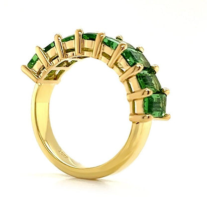 18k gold half band ring with 2.7 ctw emerald-cut tsavorite garnets by Diamond Tales