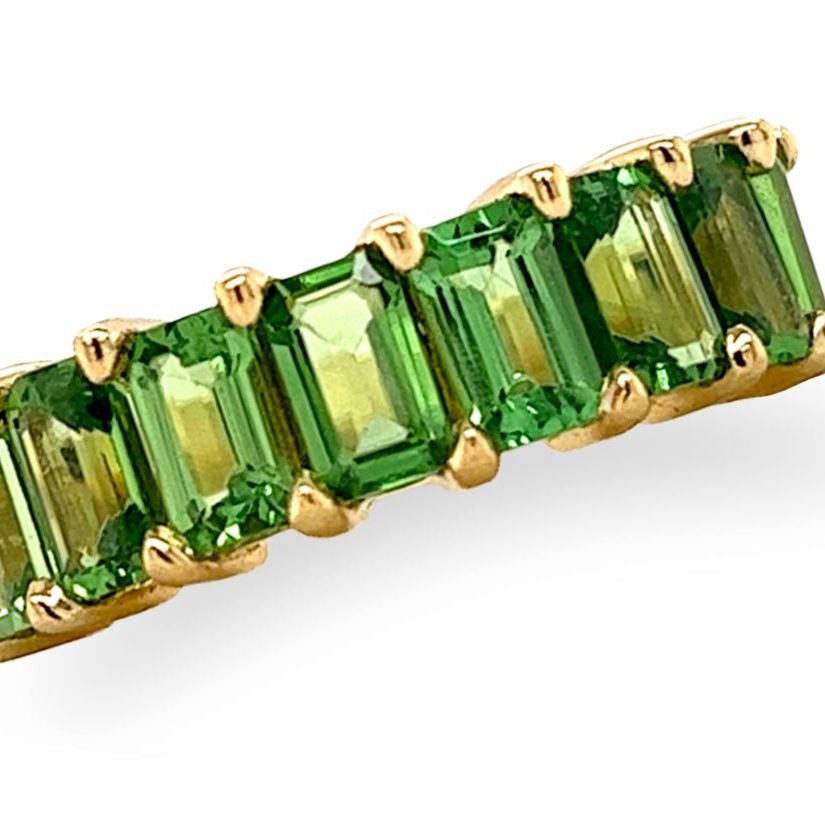 18k gold half band ring with 2.7 ctw emerald-cut tsavorite garnets by Diamond Tales