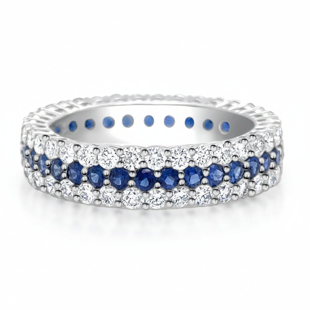 18k white gold full band ring with blue sapphires and round brilliant diamonds by Diamond Tales