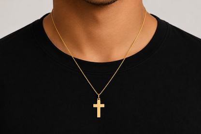 polished 14k gold cross pendant, close up