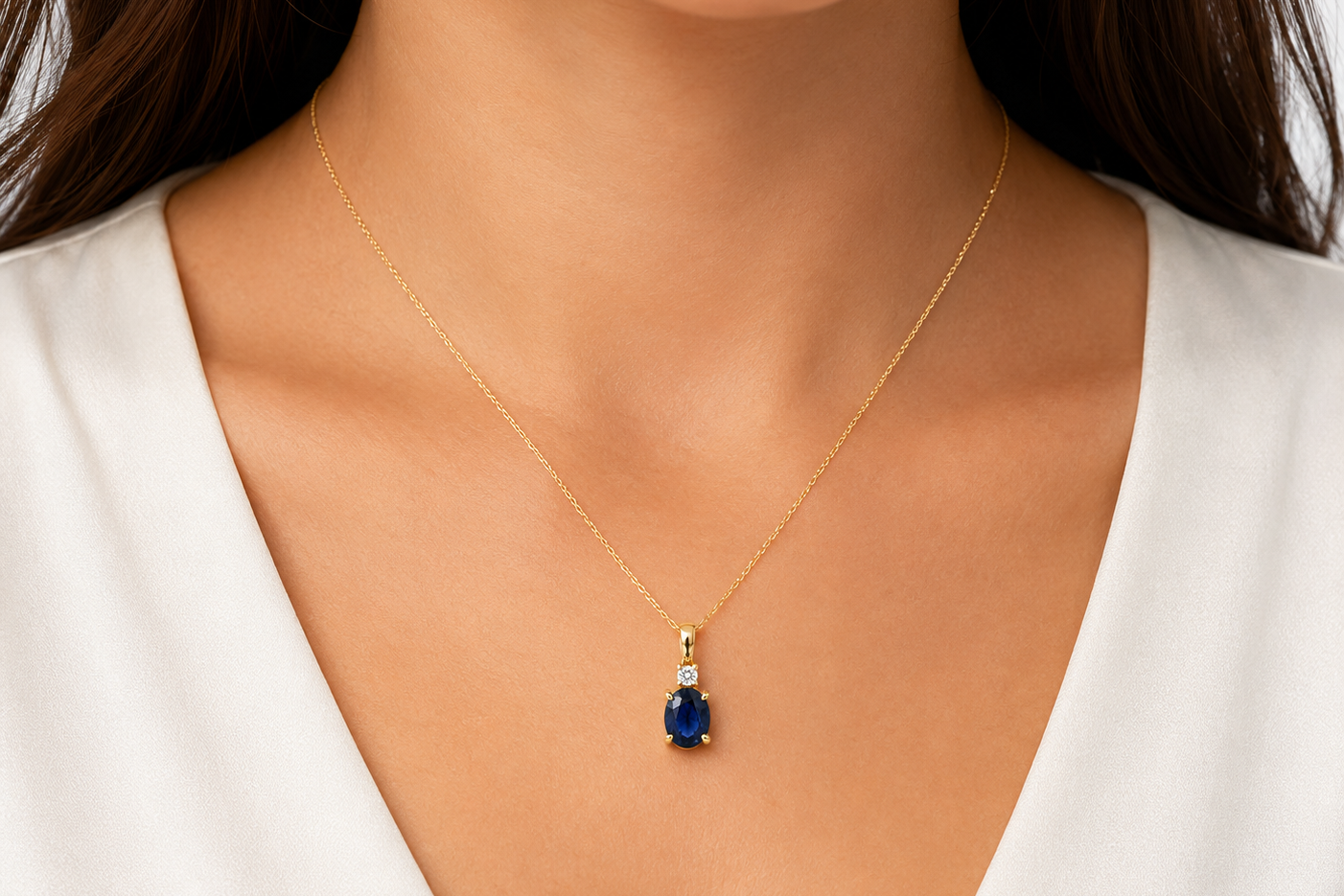 oval blue sapphire and diamond pendant necklace in 14k gold, detail view