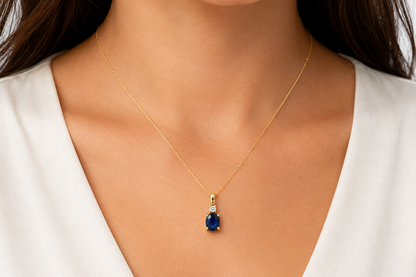 oval blue sapphire and diamond pendant necklace in 14k gold, detail view