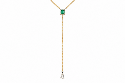 pear shaped diamond drop with bezel set diamond accents, close up
