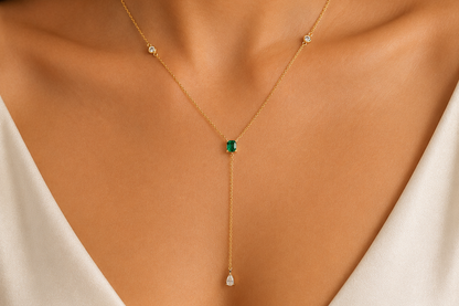 emerald and diamond drop necklace in 14k yellow gold, detail view
