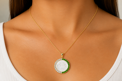 Virgen de Coromoto gold medal with tsavorite garnet border, detail view