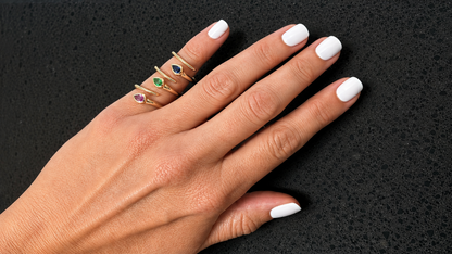 pear shape gemstone spring ring in 14k yellow gold, detail view