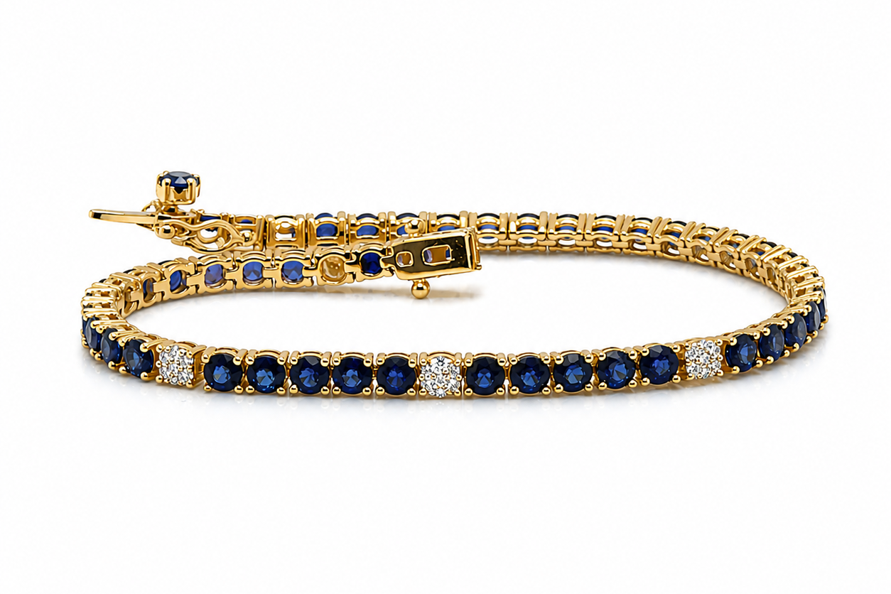 14kt yellow gold tennis bracelet with blue sapphires and diamonds by Albert Hern