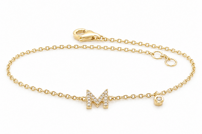 Pavé diamond letter initial bracelet in 14kt yellow gold, close-up detail