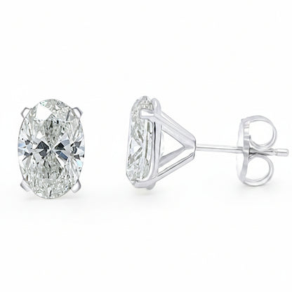 Platinum oval diamond stud earrings with 4.06 cts total GIA-certified diamonds