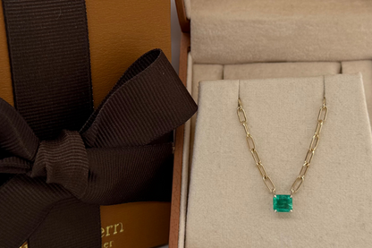 natural emerald station on 14k gold paper clip chain, close up