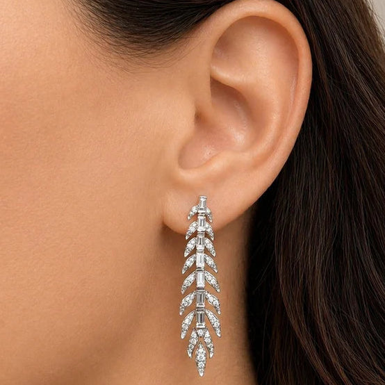 Leaf-shape drop earrings in 18k white gold with marquise and round diamonds by Diamond Tales