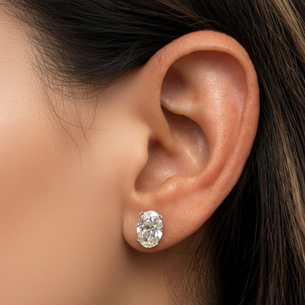 Platinum oval diamond stud earrings with 4.06 cts total GIA-certified diamonds
