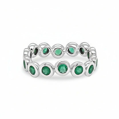 18k white gold ring with bezel-set round emeralds totaling 0.95 carats