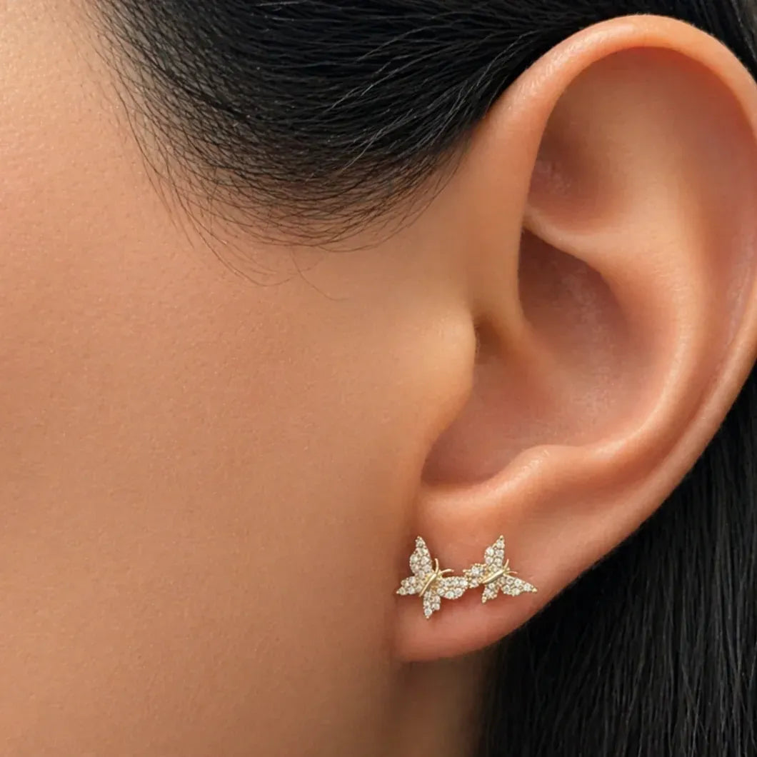 18k rose gold butterfly stud earrings with asymmetrical wings and diamond pavé