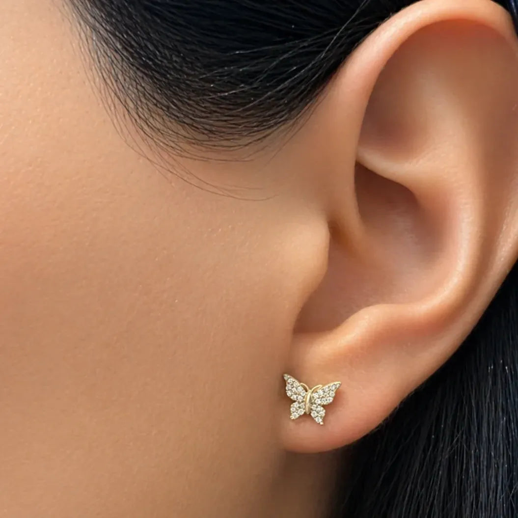 18k rose gold butterfly stud earrings with asymmetrical wings and diamond pavé