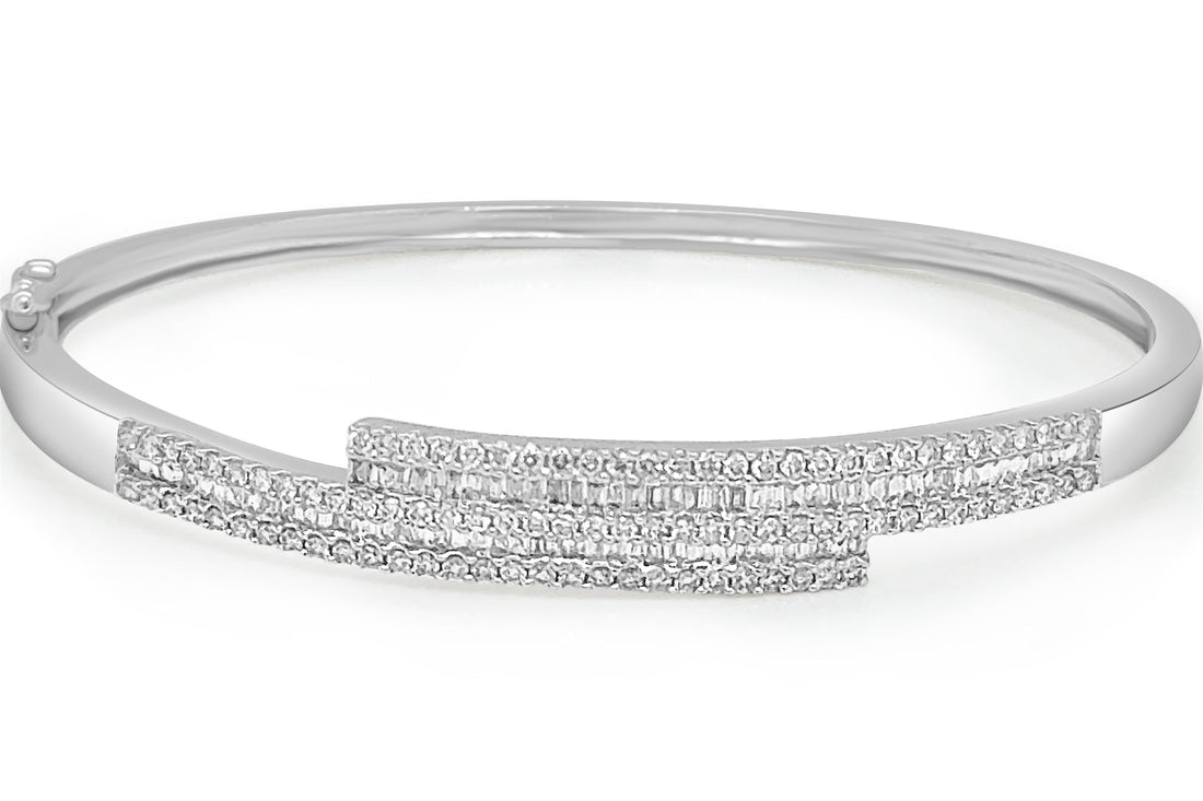 18k gold bangle bracelet with baguette and round brilliant diamonds by Diamond Tales