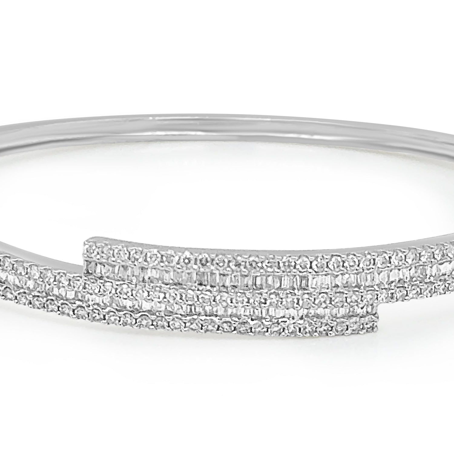 18k gold bangle bracelet with baguette and round brilliant diamonds by Diamond Tales