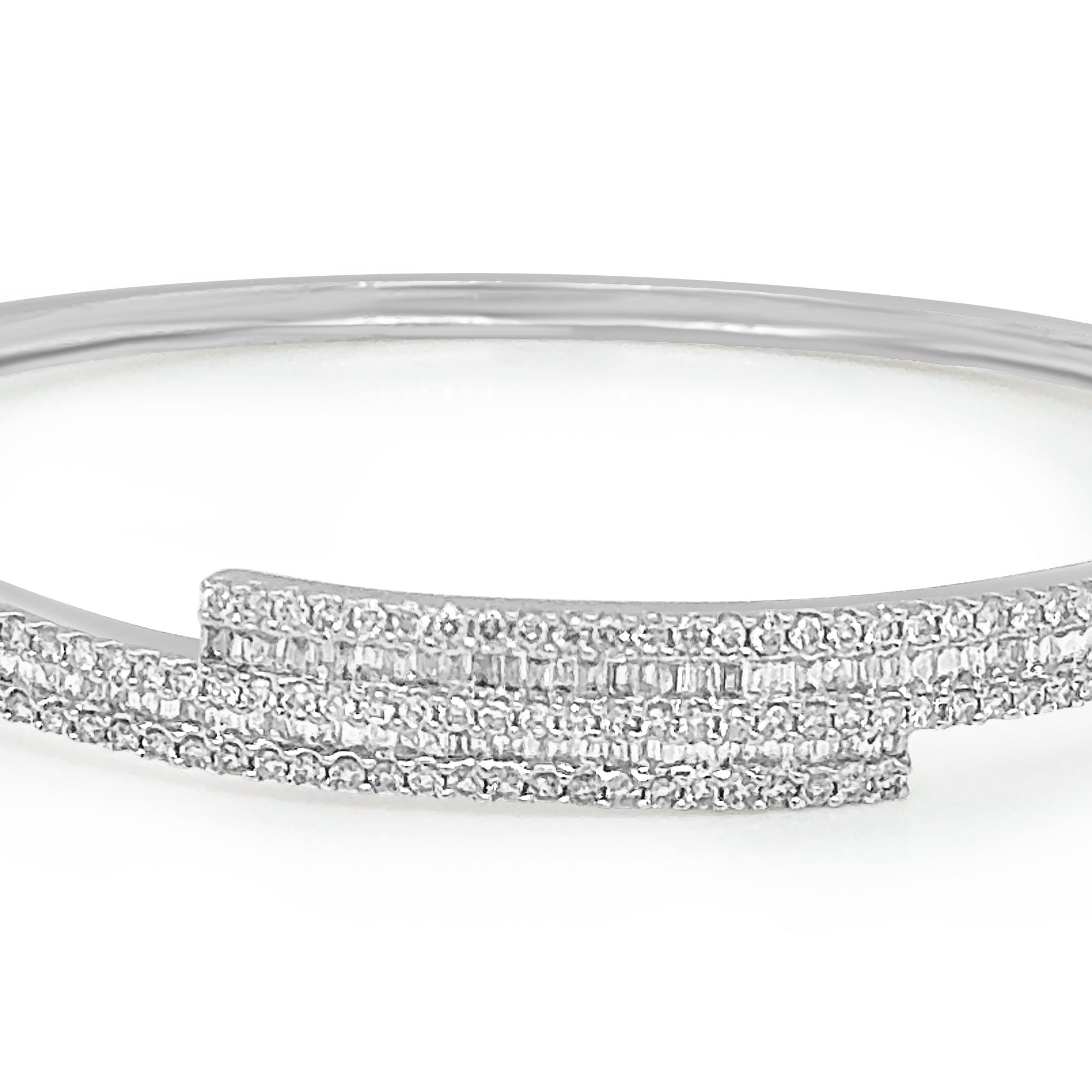 18k gold bangle bracelet with baguette and round brilliant diamonds by Diamond Tales
