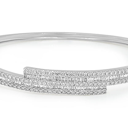 18k gold bangle bracelet with baguette and round brilliant diamonds by Diamond Tales
