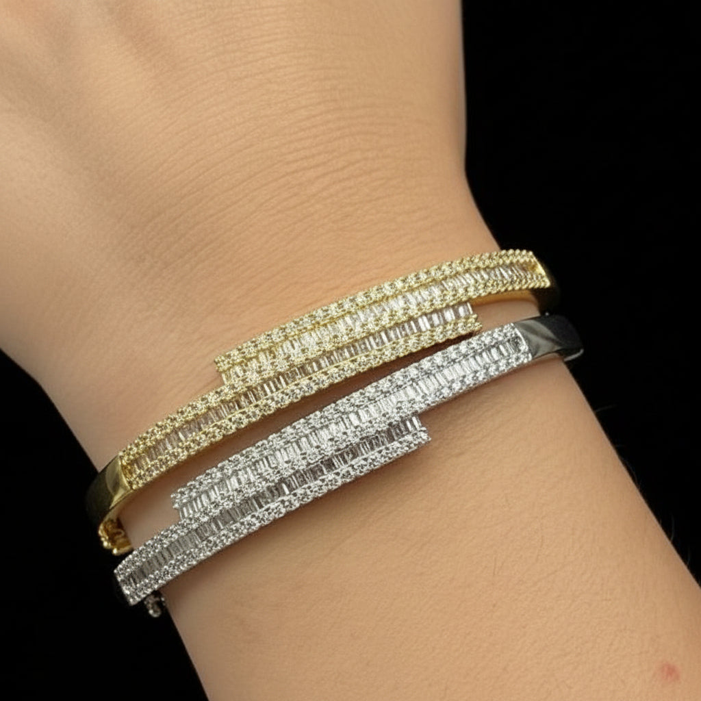 18k gold bangle bracelet with baguette and round brilliant diamonds by Diamond Tales