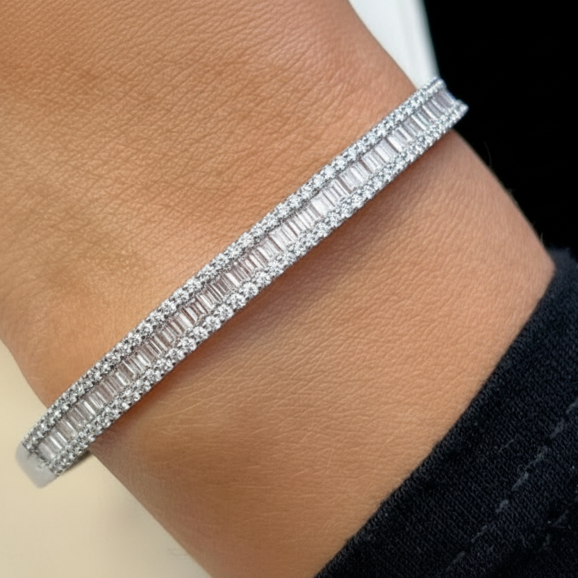 18k gold bangle bracelet with baguette and round brilliant diamonds by Diamond Tales