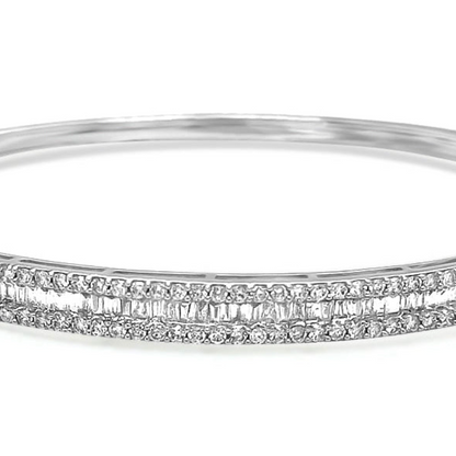 18k gold bangle bracelet with baguette and round brilliant diamonds by Diamond Tales