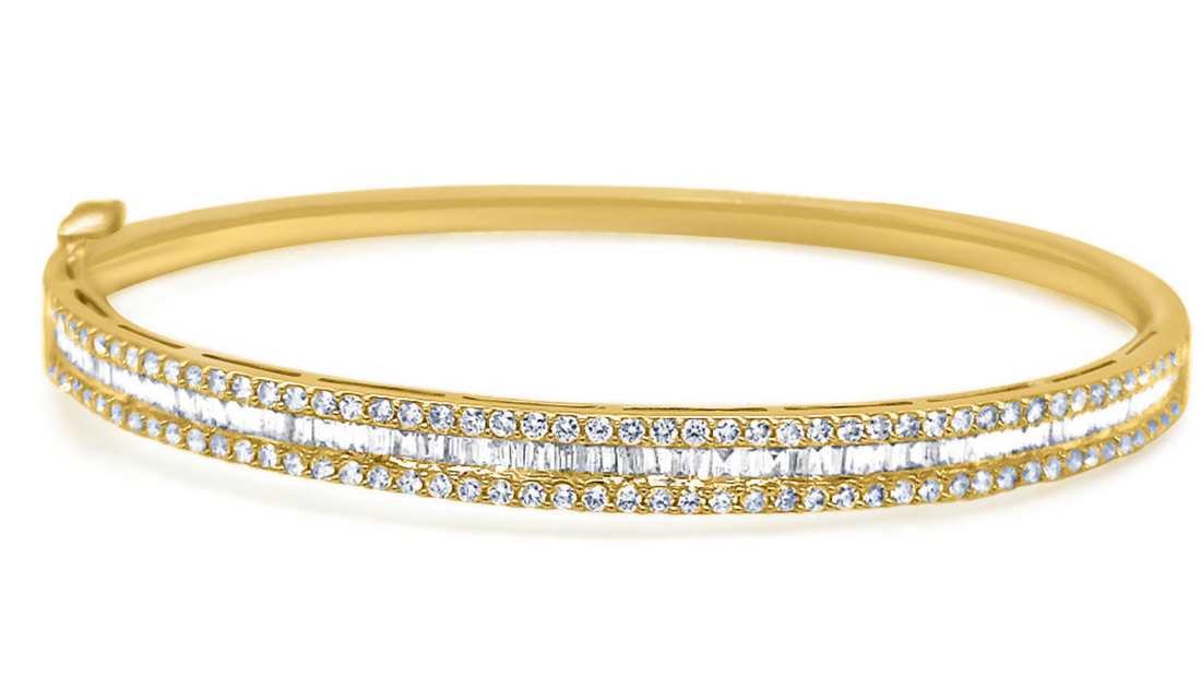 18k gold bangle bracelet with baguette and round brilliant diamonds by Diamond Tales