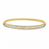 18k gold bangle bracelet with baguette and round brilliant diamonds by Diamond Tales
