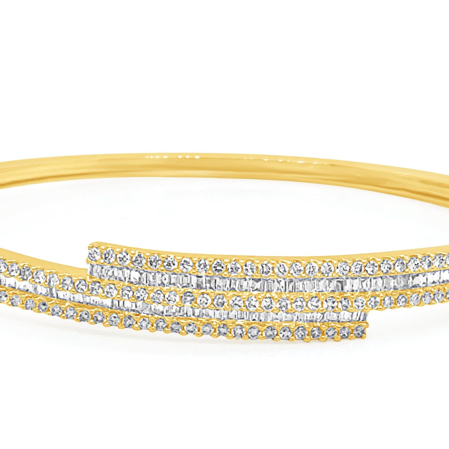 18k gold bangle bracelet with baguette and round brilliant diamonds by Diamond Tales