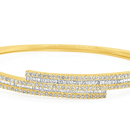 18k gold bangle bracelet with baguette and round brilliant diamonds by Diamond Tales