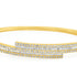 18k gold bangle bracelet with baguette and round brilliant diamonds by Diamond Tales