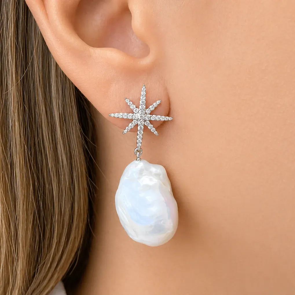 14k gold drop earrings with baroque pearls and star-shaped diamond accents