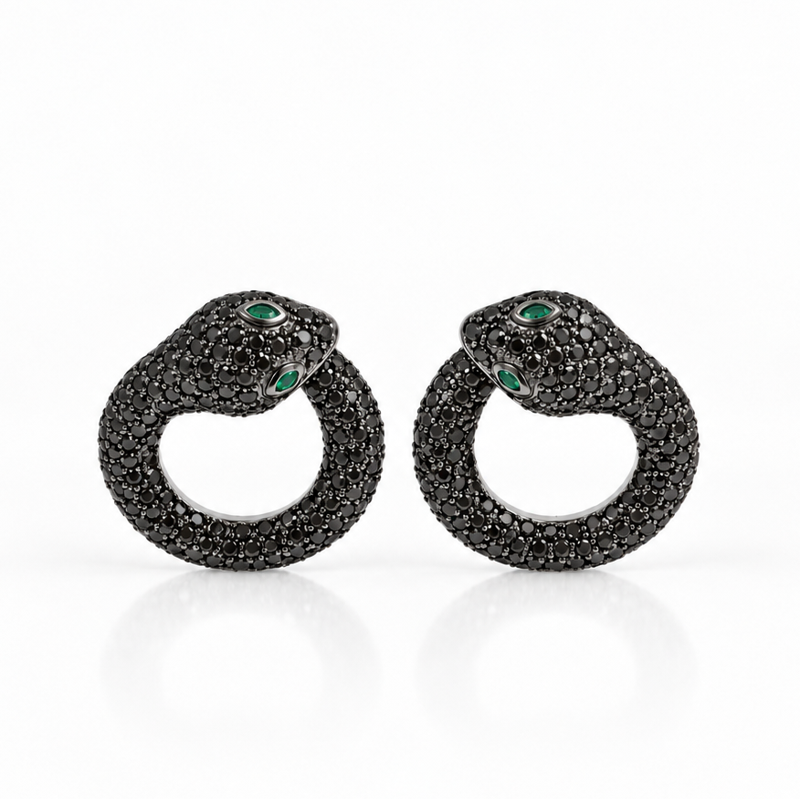 Snake earrings in 18k white gold paved with black diamonds and emerald accents