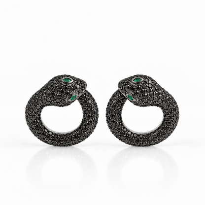 Snake earrings in 18k white gold paved with black diamonds and emerald accents